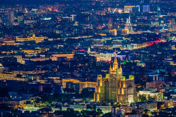 Obraz premium Moscow. Russia. View of night Moscow from a quadrocopter. Evening capital view from the drone. Luminous skyscraper rises above Moscow. Capital of Russia at night. Seven sisters. Tourism to Russia