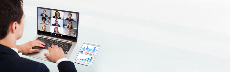 Businessman Video Conferencing On Laptop In Office