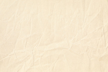 Old pale yellow crumpled paper background texture