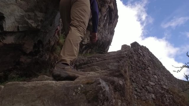 Hiker on stone stairs, Inca trail, Cusco, Peru