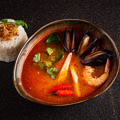 Spanish Suquet de Peix soup. Horizontal top view from above