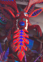 Alebrijes are brightly colored Mexican folk art sculptures of fantastical creatures, important of Mexican culture