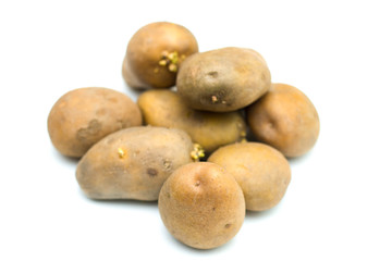 Close up potatoes over white background.
