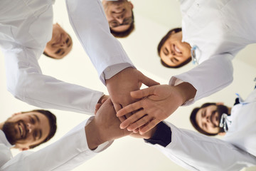 Fototapeta na wymiar Group of doctors joined hands together. Medicine healthcare clinic hospital concept .