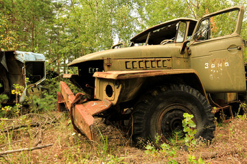 Old soviet military truck car trash in woods near Chernobyl in Prypyat