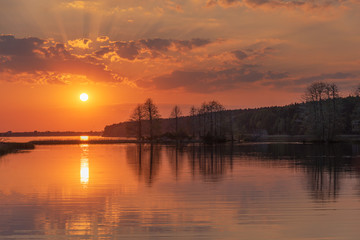 Fototapeta premium charming landscape on the river at sunset and night time
