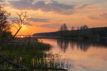 charming landscape on the river at sunset and night time