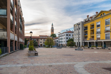 Fototapeta na wymiar Typical town center with stone pavement in northern Italy. The town of Malnate located in the Lombardy region