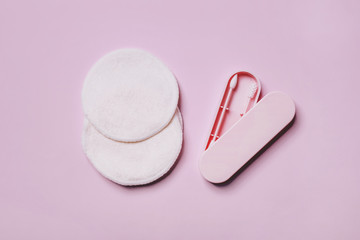 Reusable Double-sided Cotton Swab Ear Pick Stick in a box and Bamboo Make Up Remover Pads on pink background. Zero waste, sustainable lifestyle concept.