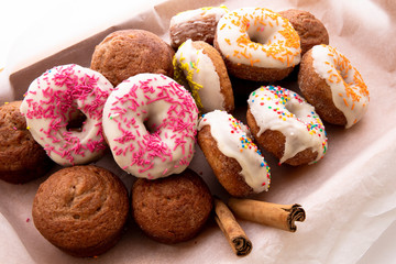 Apple Cinnamon Muffins and donuts with apples and cinnamon sticks