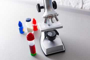 Coronavirus Covid 19 infected blood sample in sample tube in hand of scientist doctor biohazard protection clothing in coronavirus covid 19 research laboratory, Coronavirus Covid-19 vaccine research