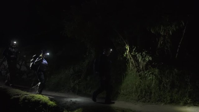 Pan. Hikers on Inca trail at night, Cusco, Peru