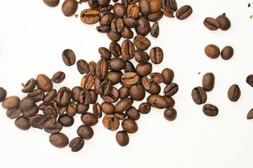 Coffee beans on white background. Top view. Shallow depth of field.