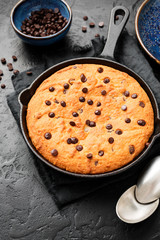 Giant skillet cookie with chocolate chips.