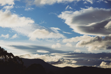 beautiful clouds over the mountains in Tasmania shot near Kunanyi