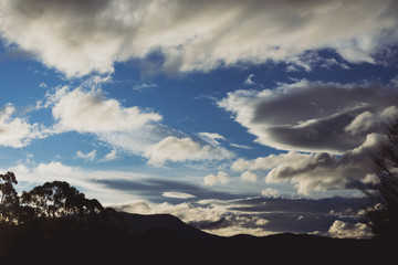 beautiful clouds over the mountains in Tasmania shot near Kunanyi