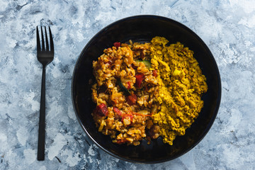 plant-based food, vegan scrambled tofu with mediterranean veggies and potatoes
