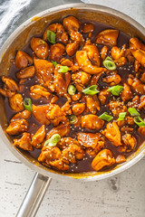 Top view portrait detail of a finished teriyaki chicken in a pot