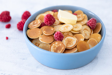 Blue Bowl for breakfast with Pancake cereals with raspberries