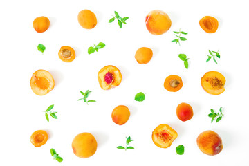 Ripe peaches with leaves isolated on white background. Summer fruits. Top view. Flat lay