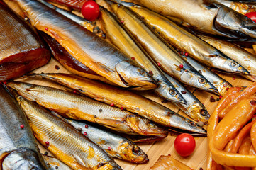 Fototapeta premium A variety of smoked fish. Beautiful fish showcase.