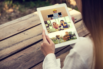 Asian Women holding tablet internet watching video online at home entertainment