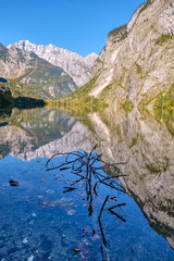 Fototapeta na wymiar The beautiful Obersee in the Bavarian Alps with a reflection of the mountains in the water