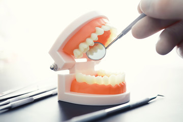 Dentist's office. Dentist examines the oral cavity before treatment. The doctor shows a course of treatment. Caries jaw treatment. Implantation and installation of veneers.