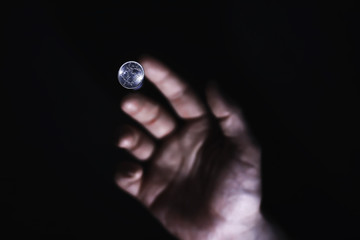 Volatility of the national currency. Russian coins with the inscription "ruble". Low ruble exchange rate. Fall of course. Financial crisis. Ruble in the hand.