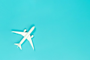 Model plane, airplane on blue pastel color background with copy space, Flat lay design travel concept on blue background. top view model plane on blue color background.