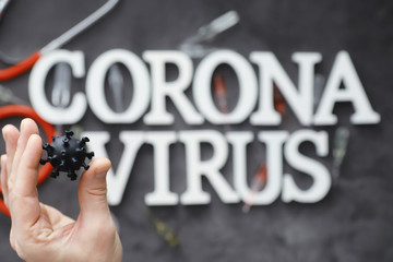 Medical background. Lettering virus. Coronavirus wooden letters. Background of the deadliest...