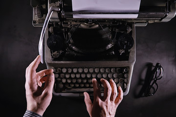 Vintage journalist tool. Typewriter retro. The writer is at work. Seal of the novel. Journalist...