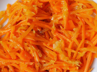 home cooking. carrots fried in oil in a hot pan. Close up