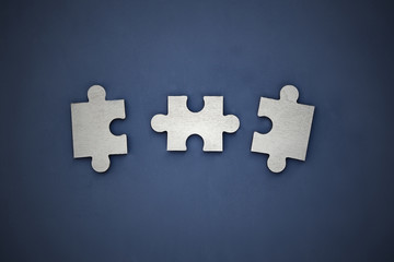 Obraz premium Puzzle on a dark background. Abstract, black