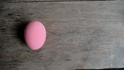 pink easter egg on wooden background