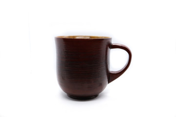 A brown wooden tea mug on the white background