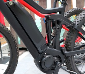 Electric mountain bike or e bike. Details of  motor, battery and suspension shock absorber. 