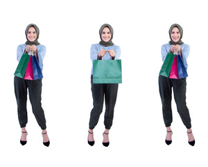 Fototapeta premium Set bundle of beautiful women of Muslim Indonesia is holding a shopping bag with a joyful expression isolated on background