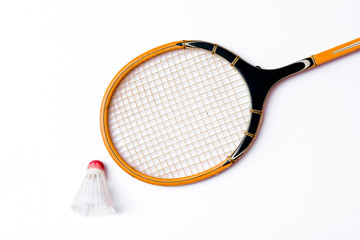Close-up.Badminton concept.Racket and shuttlecock.Badminton racket and white shuttlecock with red...