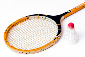 Close-up.Badminton concept.Racket and shuttlecock.Badminton racket and white shuttlecock with red cap on white background.