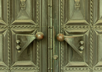 vintage brass door with round handles in a web