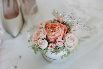 Accessories for the bride: shoes, wedding bouquet and eau de toilette. Morning bride