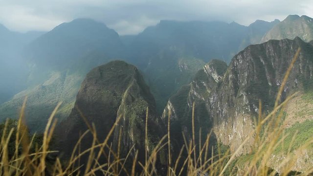 Grass with wind, Mountains. Machu Picchu, Cusco, Peru