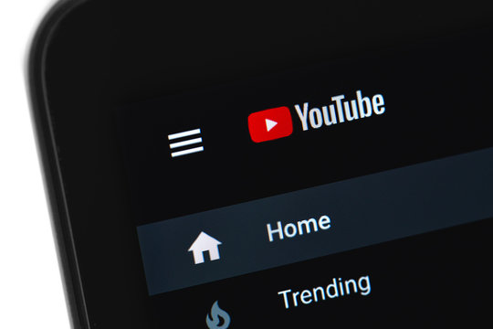 YouTube logo homepage with dark mode on the display laptop, closeup. YouTube is a free video sharing application that anyone can watch. Moscow, Russia - April 20, 2020