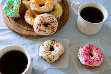 Sweet Donuts And Two Cups Of Coffee