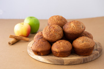 Apple Cinnamon Muffins with apples and cinnamon sticks