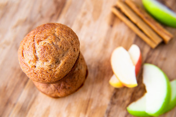 Apple Cinnamon Muffins with apples and cinnamon sticks