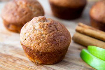 Apple Cinnamon Muffins with apples and cinnamon sticks