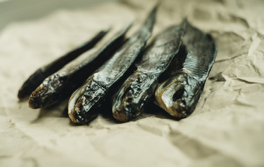 dried fish on a brown background close-up