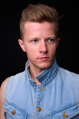 Face of rebellious man as punk rocker